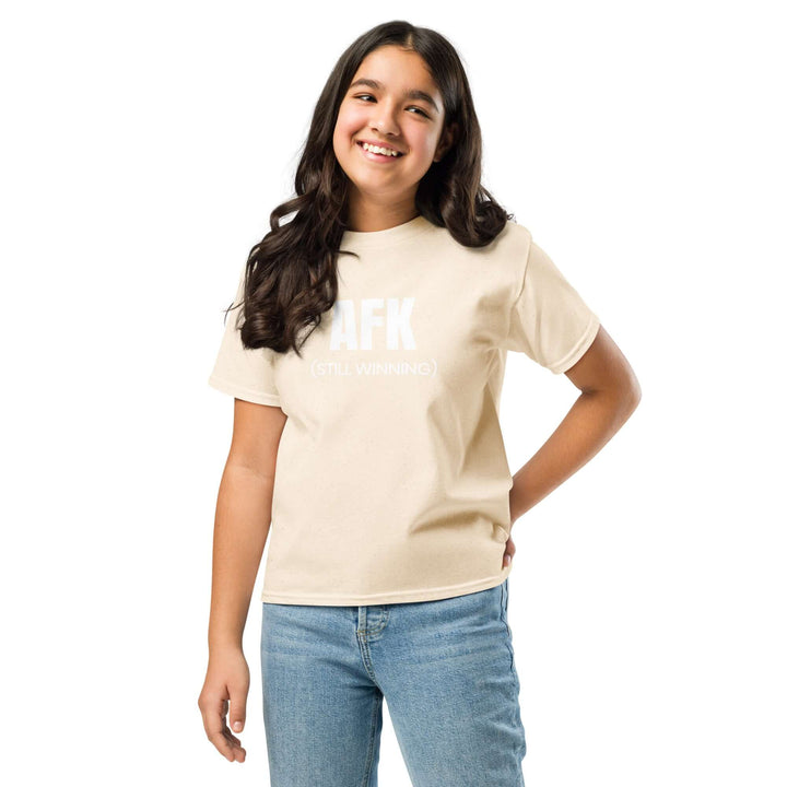 AFK Youth classic tee in beige worn by a smiling girl, showcasing comfort and style for kids.