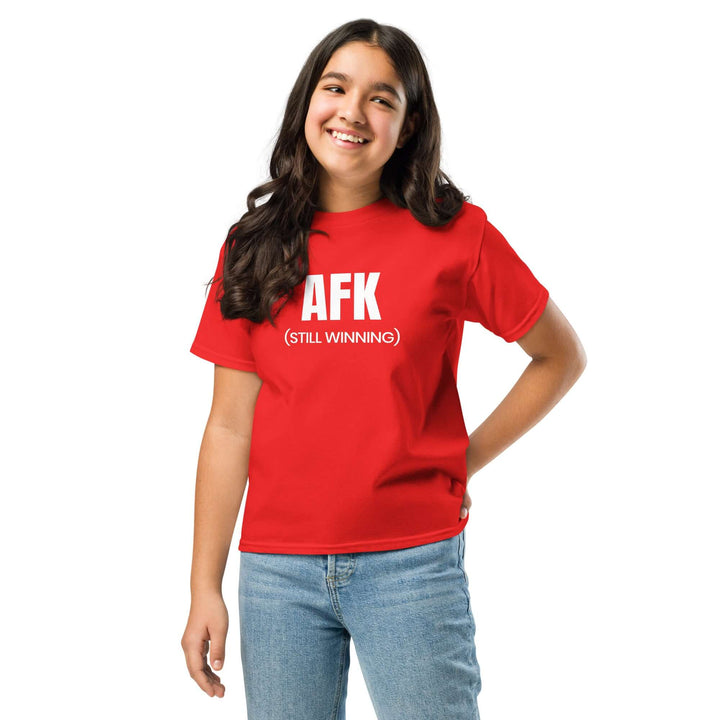 AFK Youth classic tee worn by a smiling girl in red, showcasing comfort and style for kids.