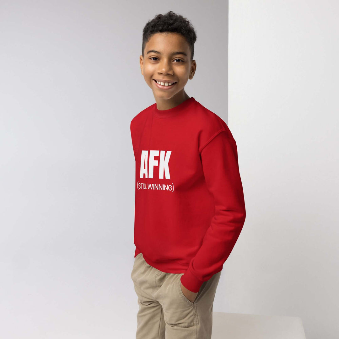 Youth crewneck sweatshirt in red with AFK logo, designed for style and comfort for active kids.