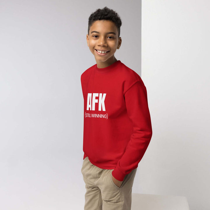 Youth crewneck sweatshirt in red with AFK logo, designed for style and comfort for active kids.