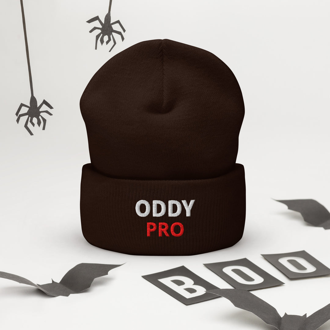 Oddy Pro Cuffed Beanie displayed with a brown color, featuring embroidered Oddy Pro text, perfect for fall fashion.