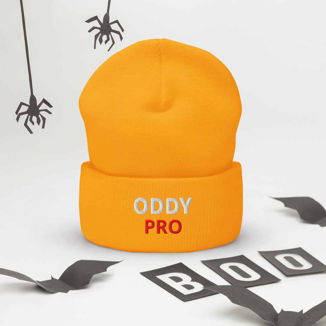 Oddy Pro Cuffed Beanie in bright orange with embroidery and Halloween decorations.