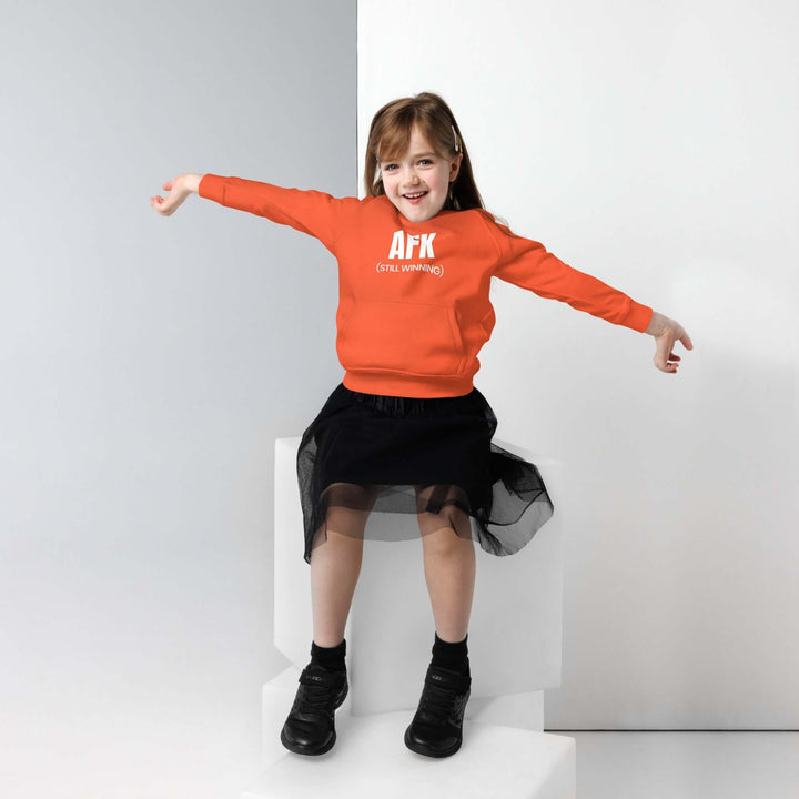 Child wearing an AFK eco-friendly kids hoodie with a stylish skirt, showcasing comfort and fun fashion.