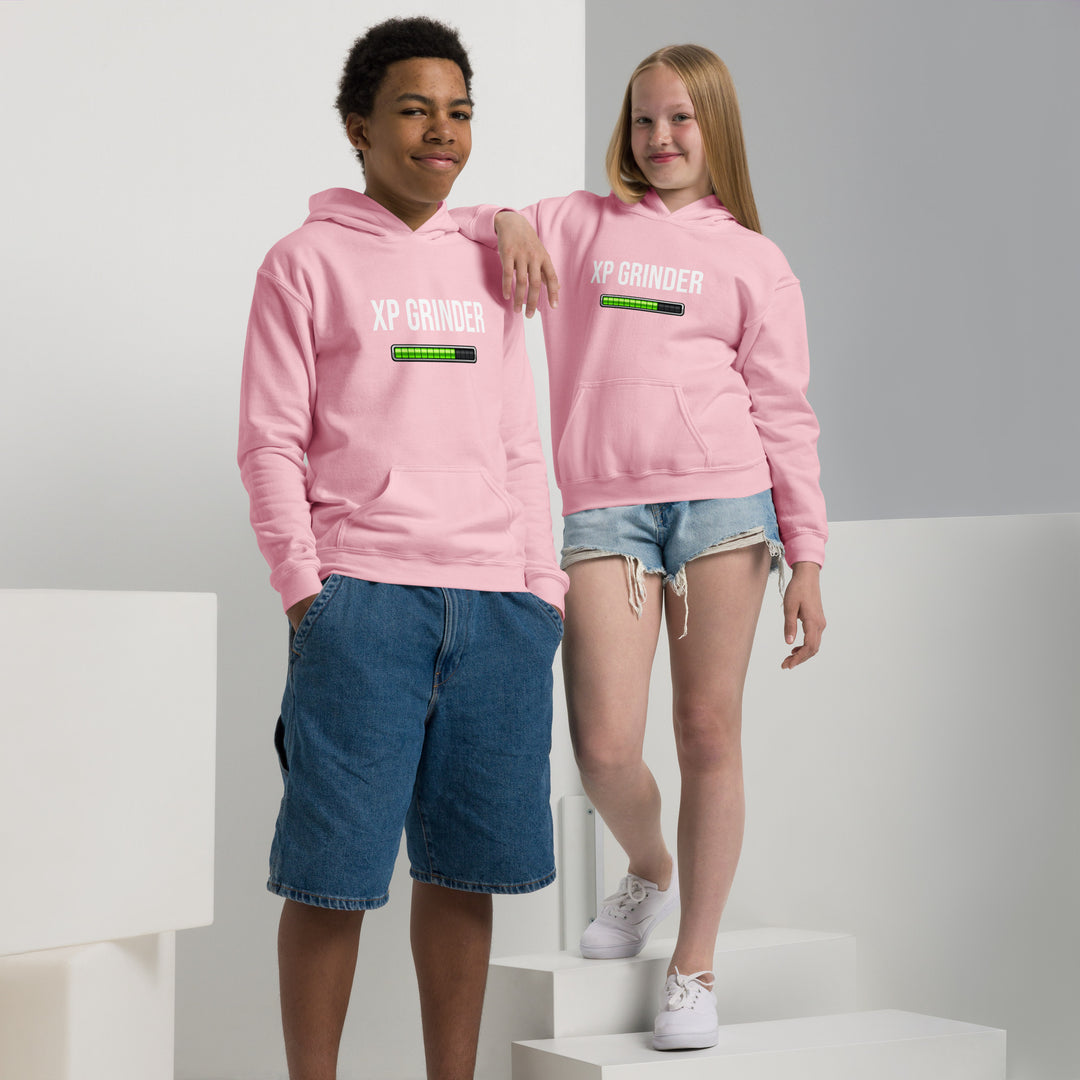 Two youth wearing XP Grinder Youth heavy blend hoodie in pink color, showcasing comfort and style.